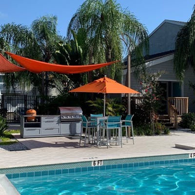orange shades over outdoor furnishings 